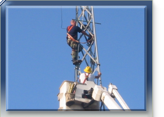 Network technician climbing mobile tower