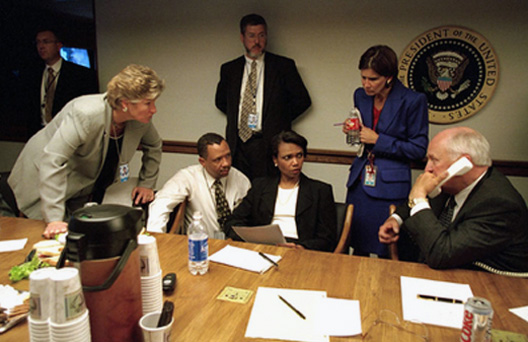 Vice President Dick Cheney talks with President Bush as senior staff listen from the National Presidential Emergency Operations Center Sept. 11, 2001.