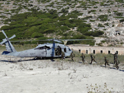 Albanian Special Forces Soldiers board a US Navy MH-60S Knighthawk helicopter.