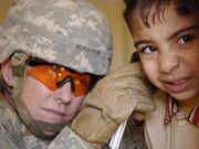 U.S. Army Capt. Cindy McPherson examines an Iraqi boy's ears during a medical and humanitarian mission in Baghdad, Iraq, on Nov. 9, 2006.